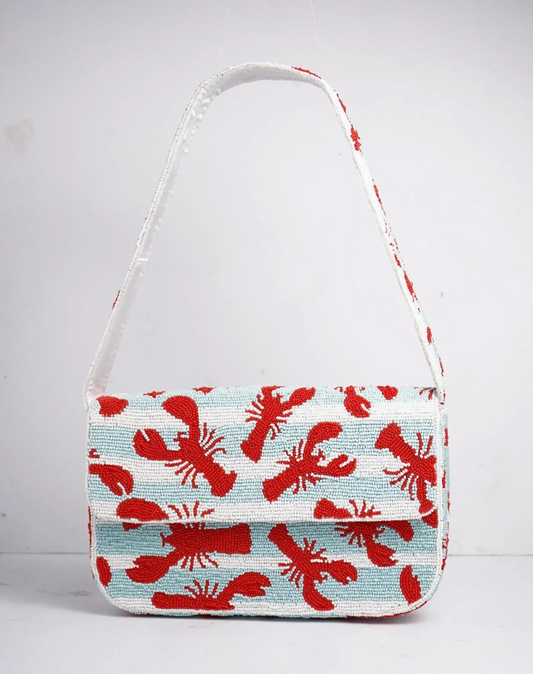 Lobster beaded shoulder bag with detailed red lobster design and structured silhouette